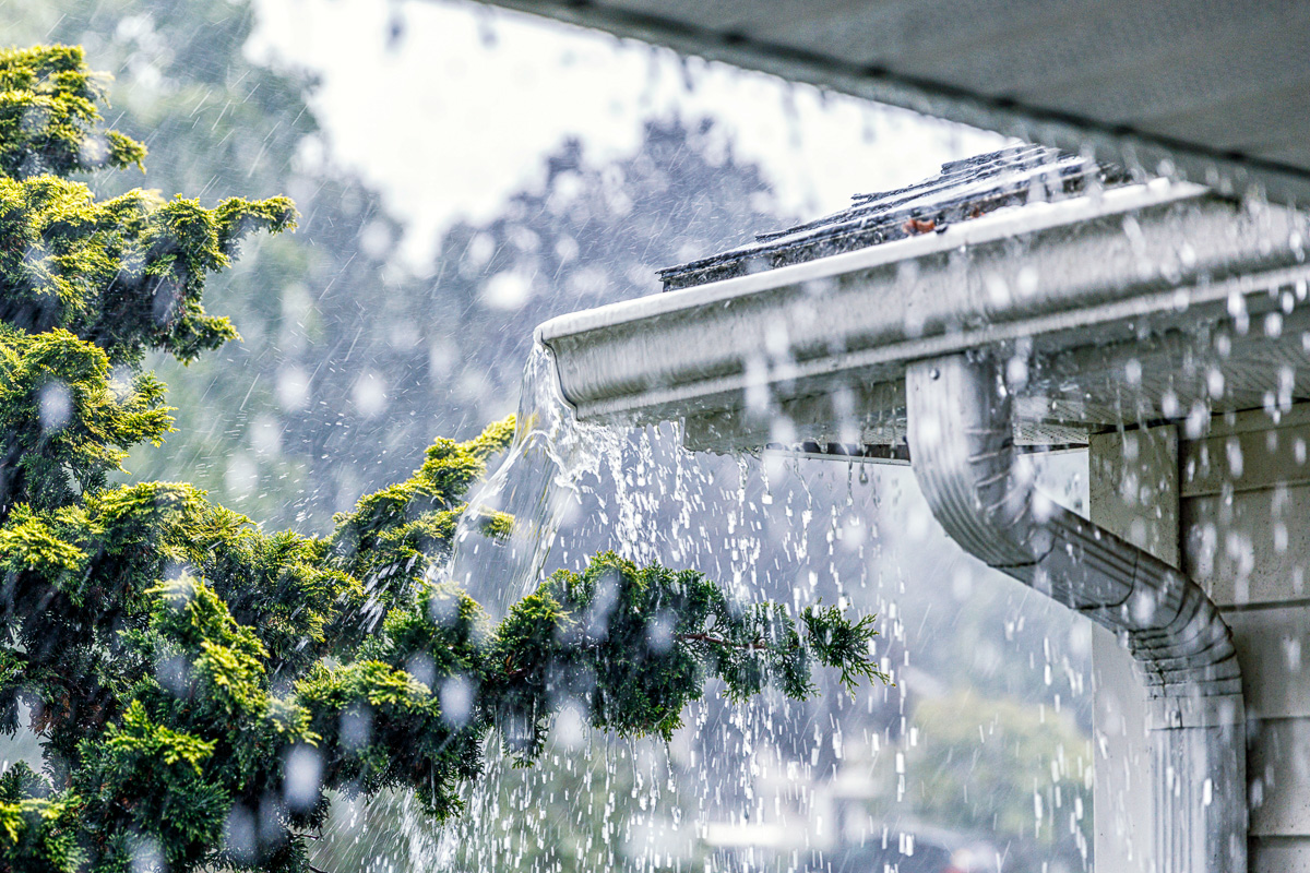 Rainwater splashing over gutter