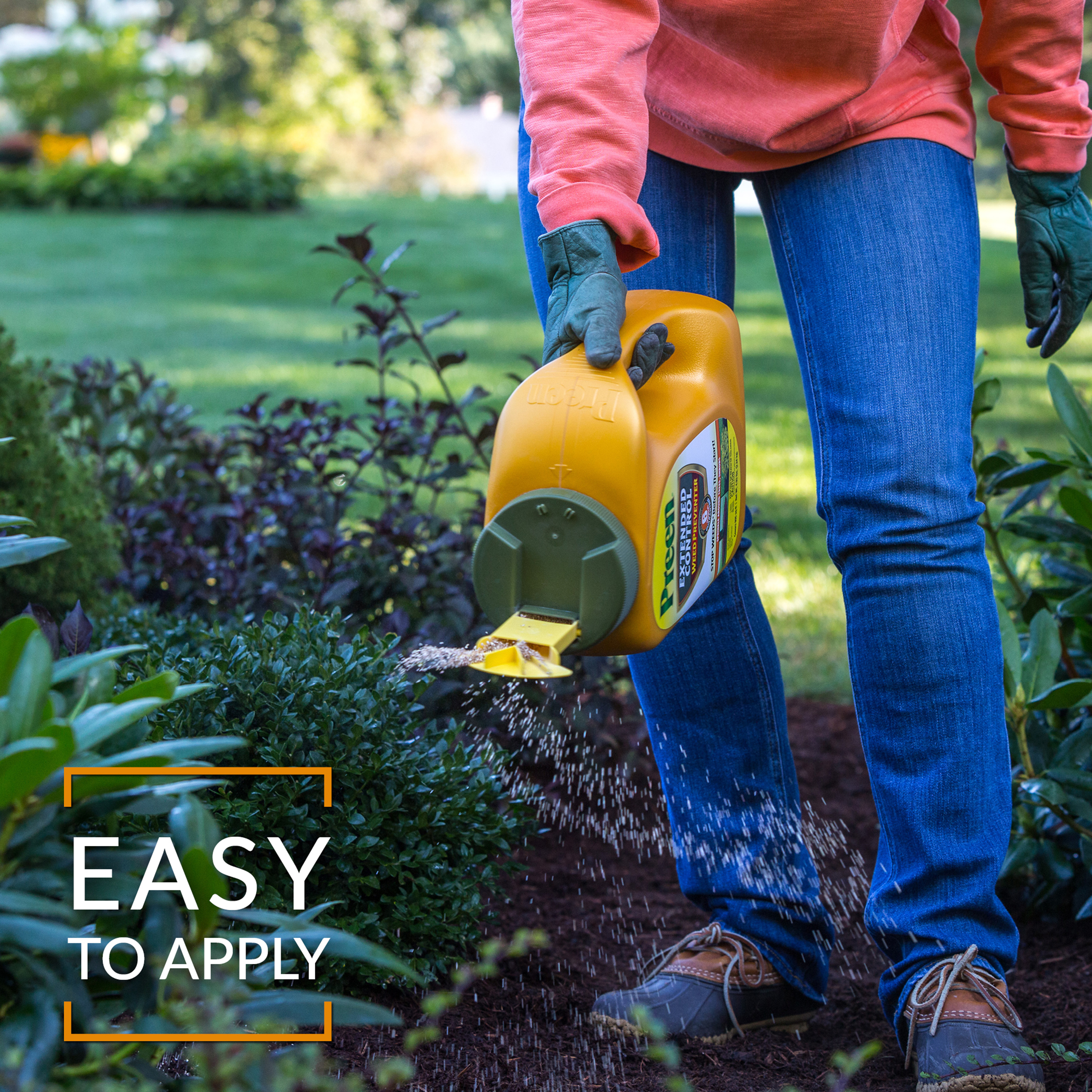 Applying Preen Extended Control Weed Preventer bottle